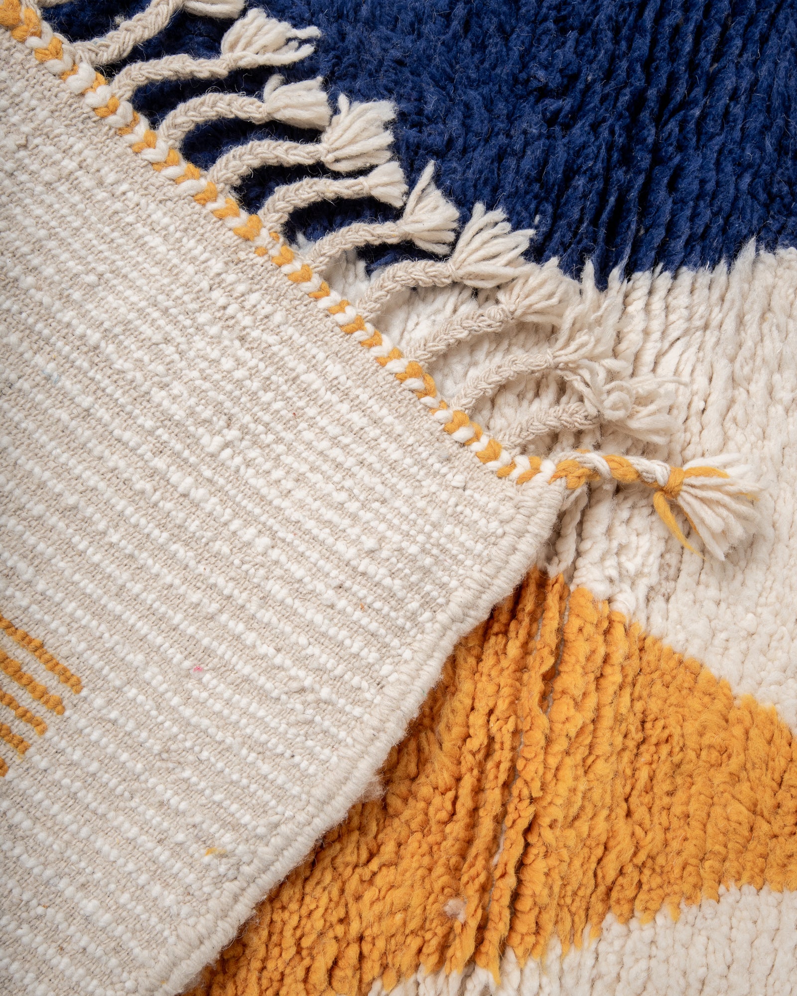 Modern, designer, handcrafted Berber rug from Morocco. Beniourain carpet with beautiful colours and patterns and fluffy wool texture.